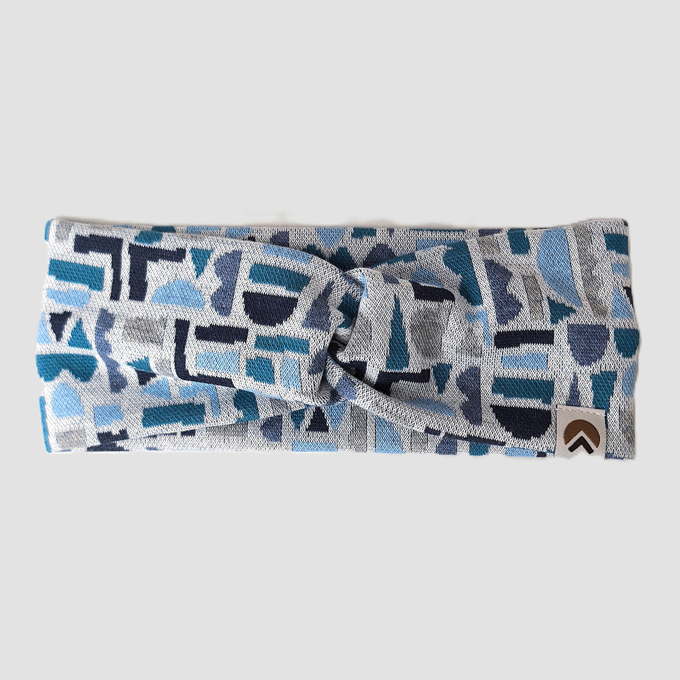 Stirnband, Bio-Baumwolle, Blau- und Grautöne, geometrisch gemustert, in der Mitte über Kreuz